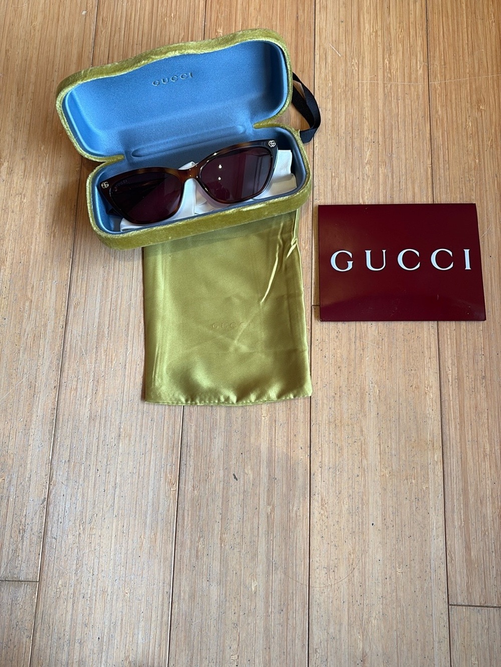 Gucci Women's Sunglasses in Brown with Gold Accents
